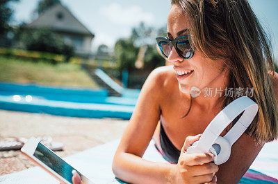 Woman by the pool can get tanned